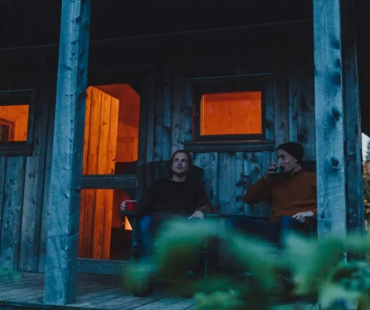 two people in front of cabin