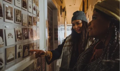 two people looking at pictures